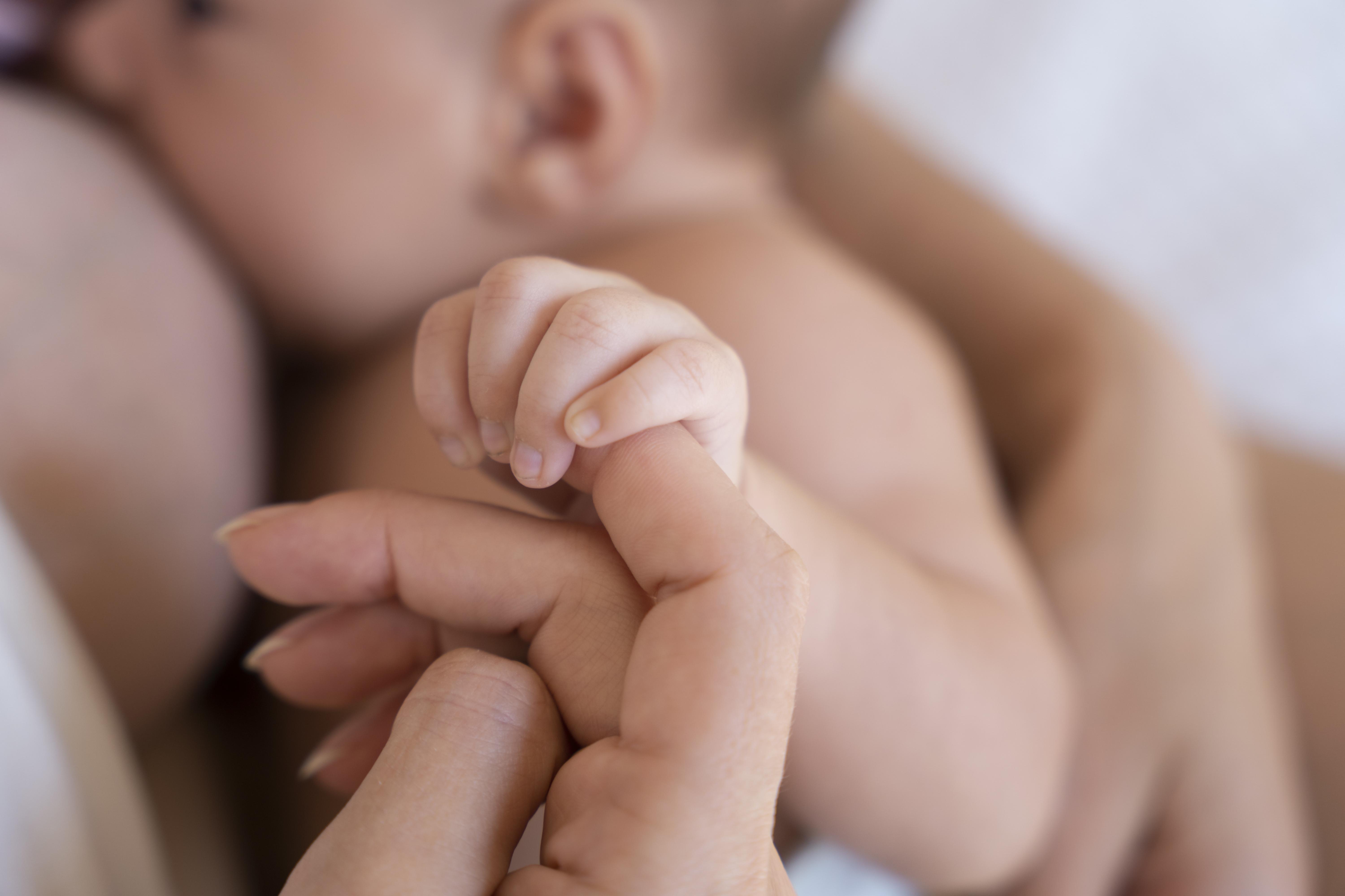 A mother and her newborn baby in the postnatal period