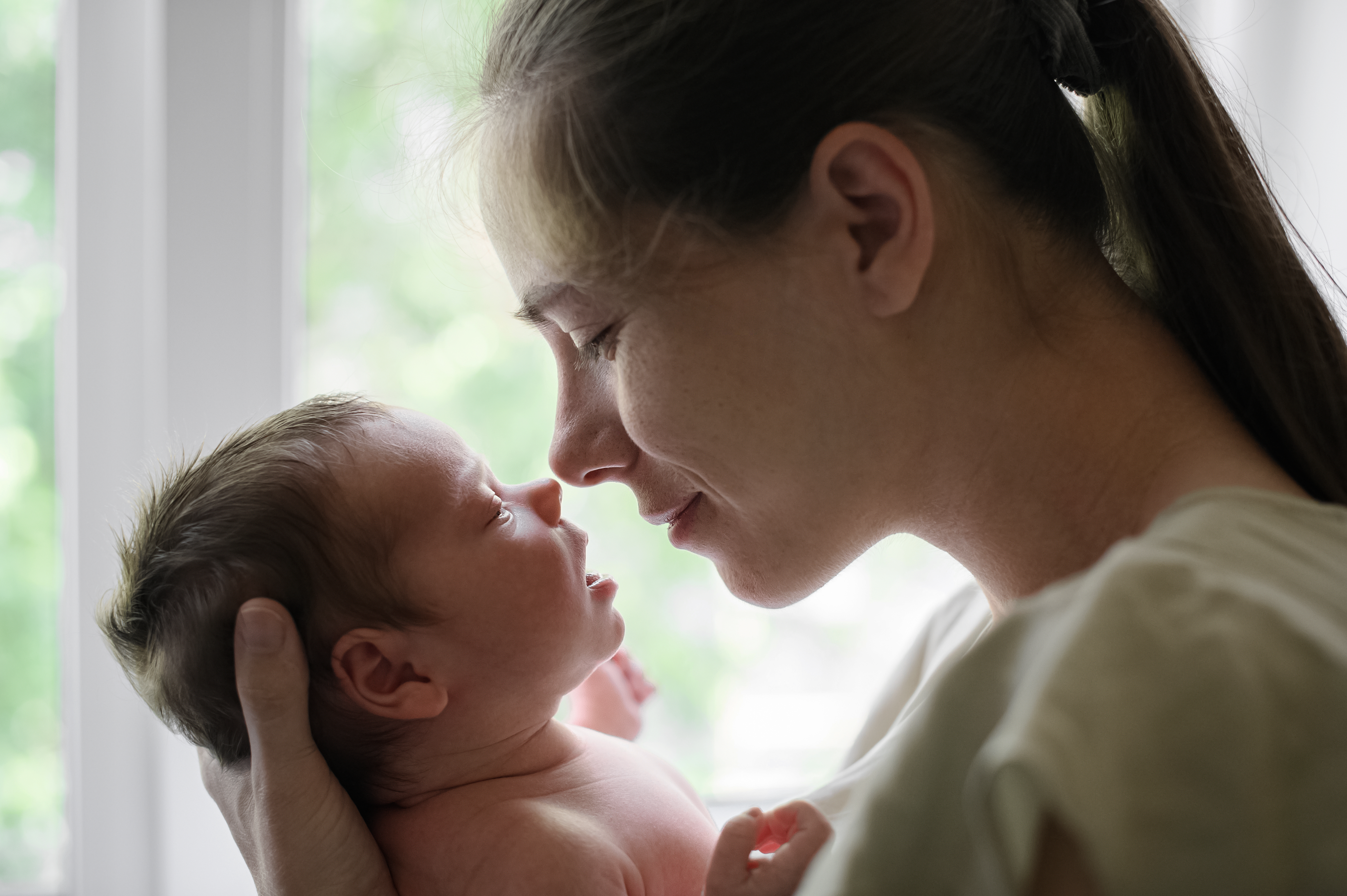 A tender moment between mother and newborn